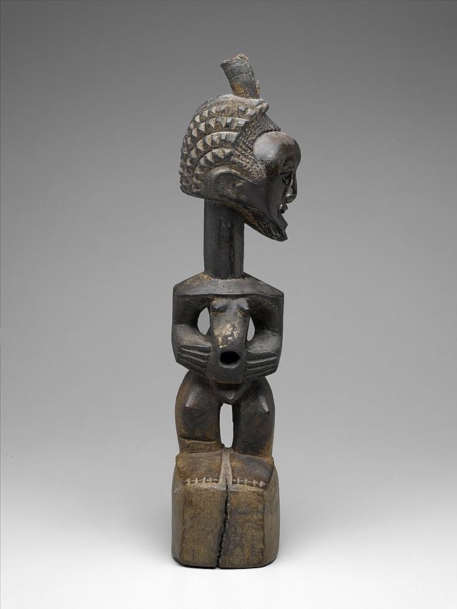 Brooklyn_Museum_2010.60_Standing_Male_Figure_with_Head_Turned_Left_Nkishi.jpg