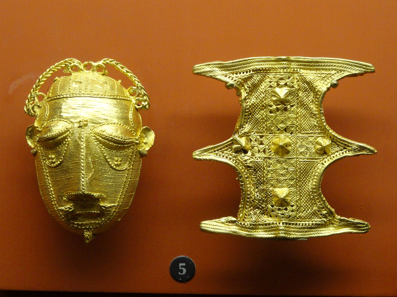Gold_ornaments_(mask_and_shield),_Ashanti_-_.JPG
